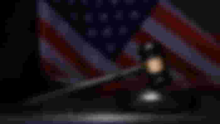 A brown gravel in front of the US flag.