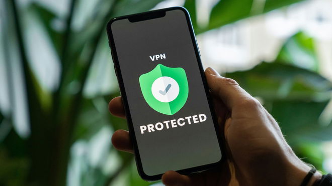 iPhone with VPN service enabled in hand