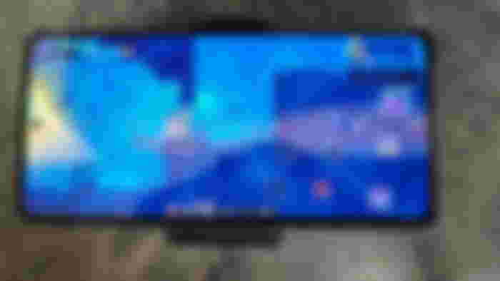 ASUS ROG Phone 8 Pro with Dead Cells playing on the screen