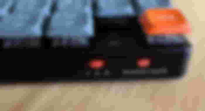 Close up of the orange switches on the back of the Keychron K5 Max.