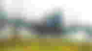 An image of Hacksmith’s huge robot spider roaming outside in foggy weather