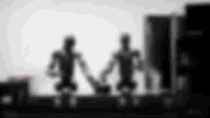 Figure robot handing cookie to another Figure robot.