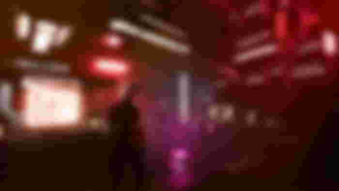 A figure standing in a neon-lit shop in Low-Fi - upcoming VR games