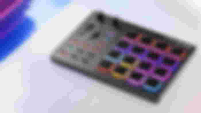 Donner Beat Maker Machine in black with multicolored lights behind each button.