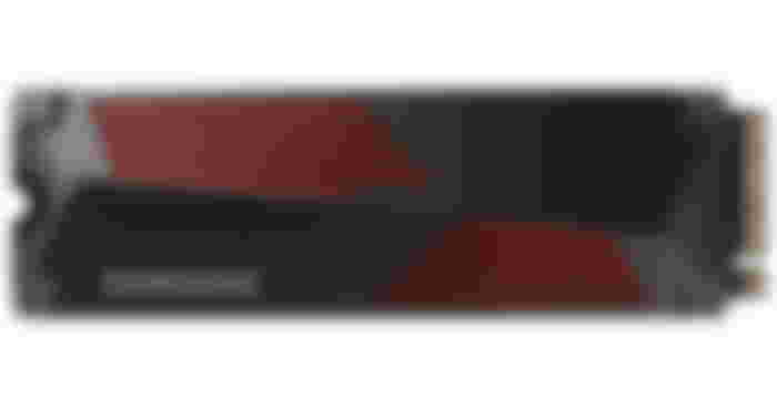 Samsung 990 Pro product image of a dark grey SSD with lighter grey branding on top with red details.