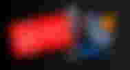 Virgin Media logo in white and red next to a Space Grey 9th Gen iPad with grey, red, orange, blue, and green sploges on the display.