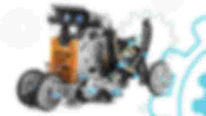 A gray, orange, and black WALL-E-like robot.