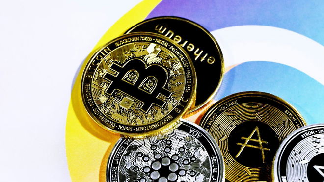 Cryptocurrency coins are together on the Quantitatives logo