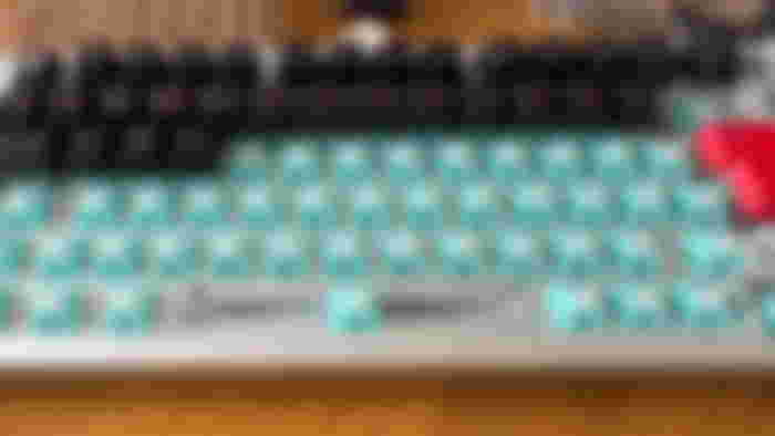 The Glorious GMMK Pro keyboard with Lynx switches installed and the Kabuto keycaps being placed