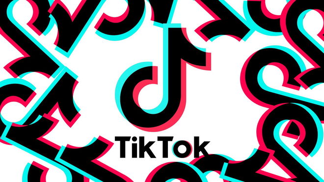 TikTok logo in front of a white background and with other TikTok logos surrounding it.