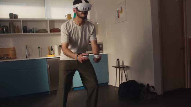 A user playing a game holding the Quest 3 controllers.