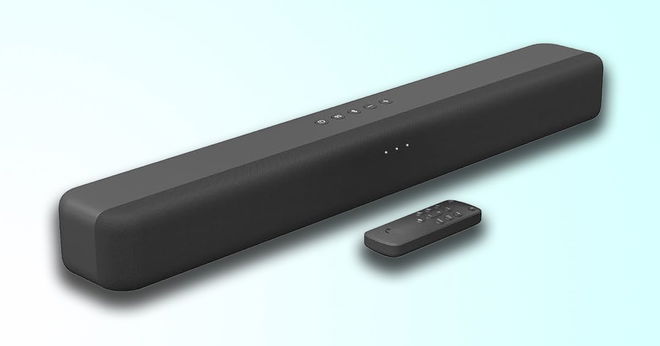 A black, rectangular soundbar with a remote in front of it in front of a white and light blue gradient background.