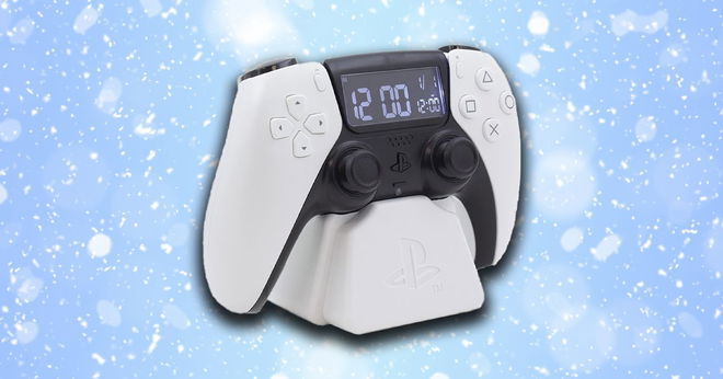 A white and black PS5 controller clock in front of a snowy blue background.