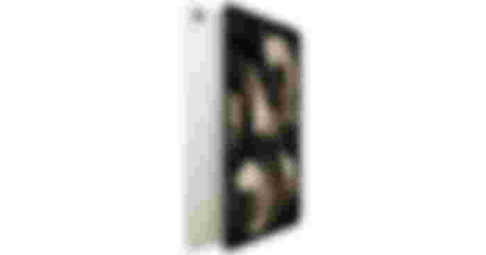 A Starlight and black iPad with a circular pattern on the display,