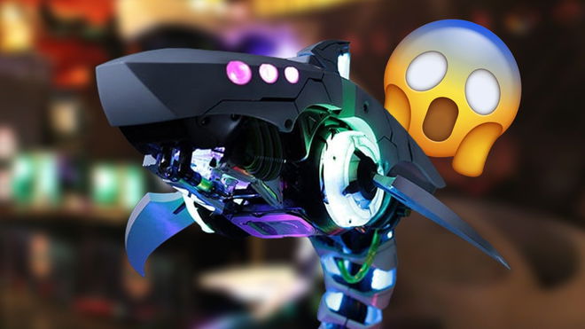 Cooler Master Shark X head in front of a blurred image and gasping emoji