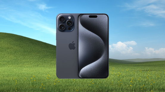 iPhone 15 Pro Max gray variant showing the screen and the back of the smartphone in front of the Microsoft Bliss wallpaper