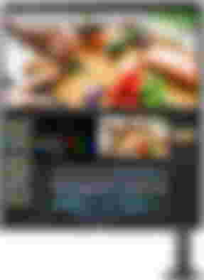 LG 28MQ780-B DualUp product image of a black monitor tilted vertically with two windows open on the display.