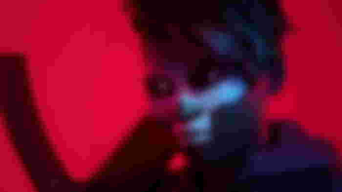 The Finals server status - An image of a person in ghost mask in a red background