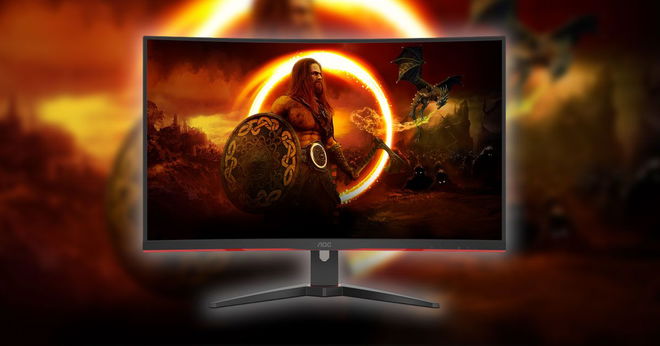 A black monitor with red trim and an image of a warrior on the screen with an orange circular light behind him.