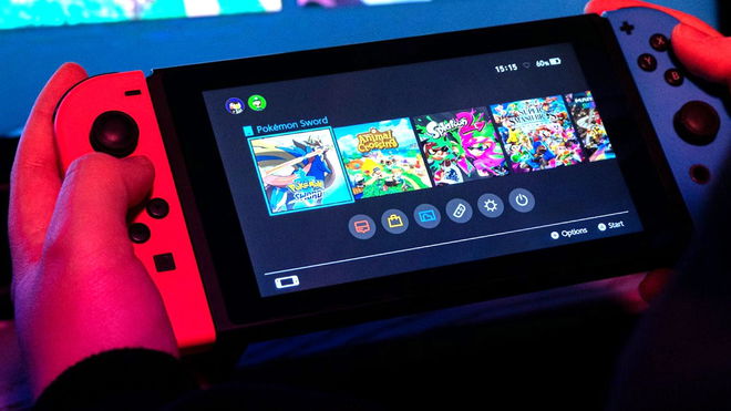 A shot of a Nintendo switch console in a user’s hand 