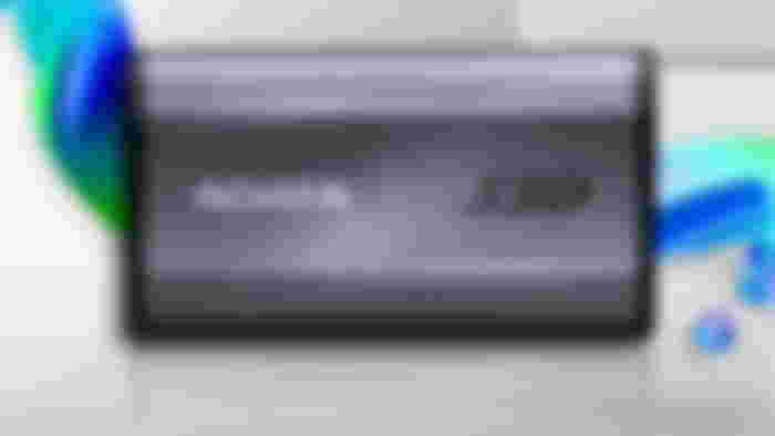 A black and light gray ADATA external SSD.