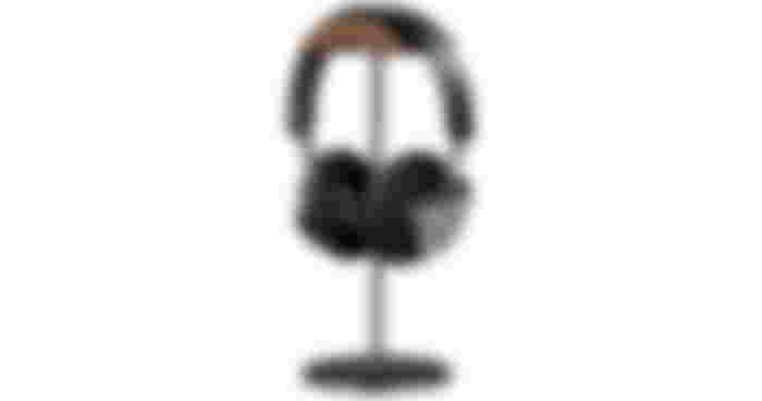 QinCoon Headphone Stand in dark gray and brown wood with over-ear headphones hanging from it.