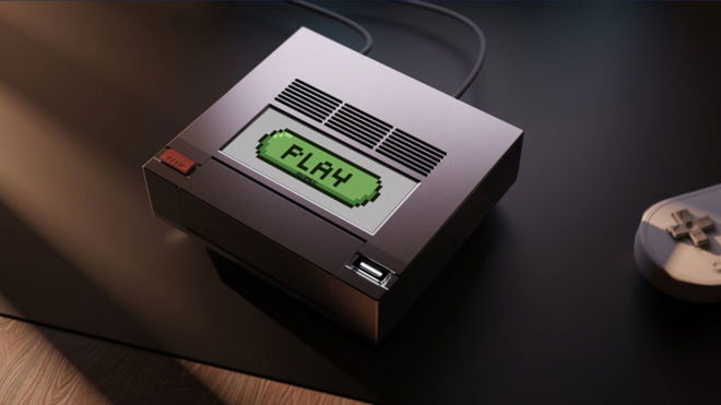 AYANEO AM02 retro mini PC sitting on a desk with PLAY written on the screen