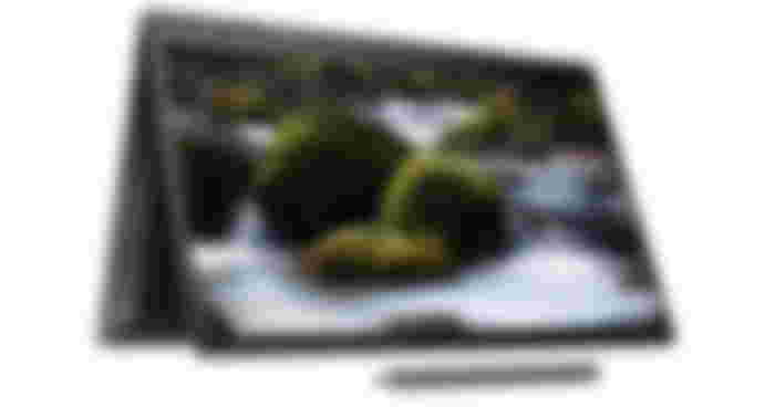 HP Envy x360 product image of a black foldable laptop with moss-covered rocks and running water on the display.