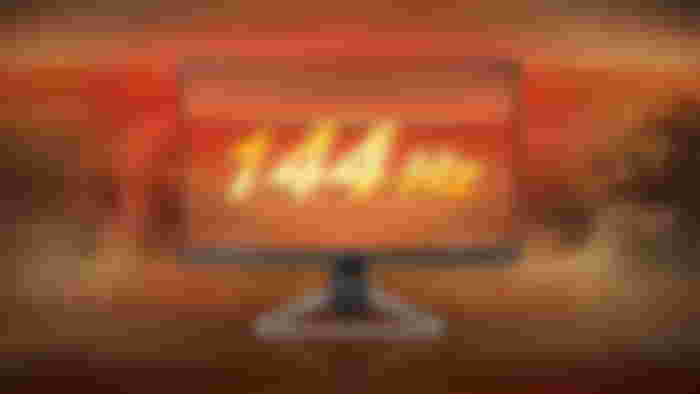 A dark grey and light grey monitor in front of a smokey orange background featuring 144Hz on the display.
