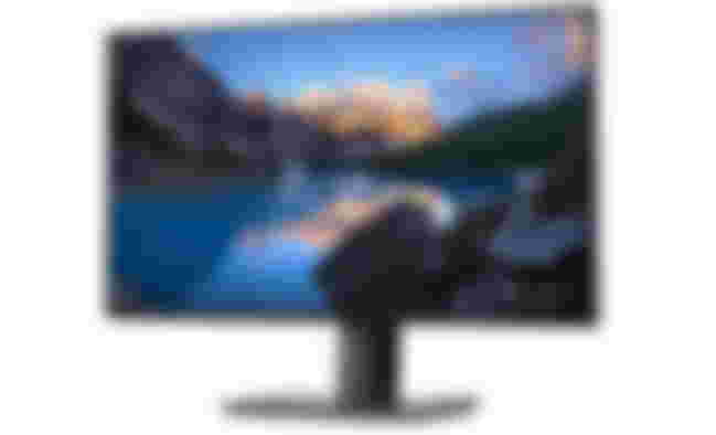 Dell U2720Q UltraSharp product image of a black monitor with a lake and mountain side scene on the display.