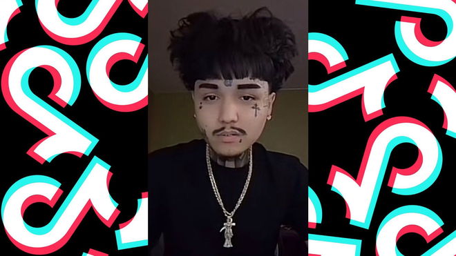 Dkane TikTok star height, image featuring Dkane with tattoos and jewelry, discussing height speculation.