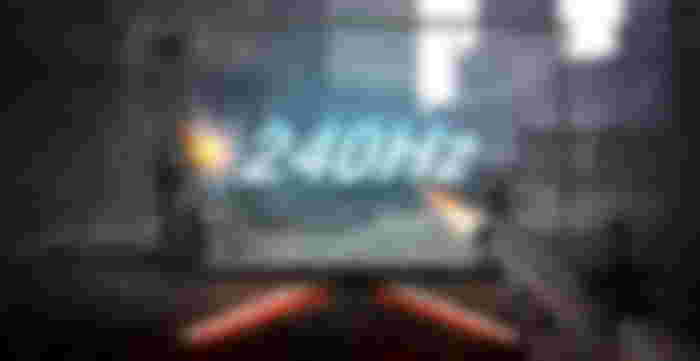 Image of a video game character firing a gun which is expanding out of a monitor with 240Hz in the centre.