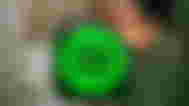 a green spotify icon with a crown on top of it .