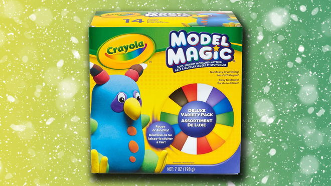 A yellow and green box of Crayola's multicolored Model Magic clay with a model of a bird character on the front. The box is in front of a yellow and green snowy background.