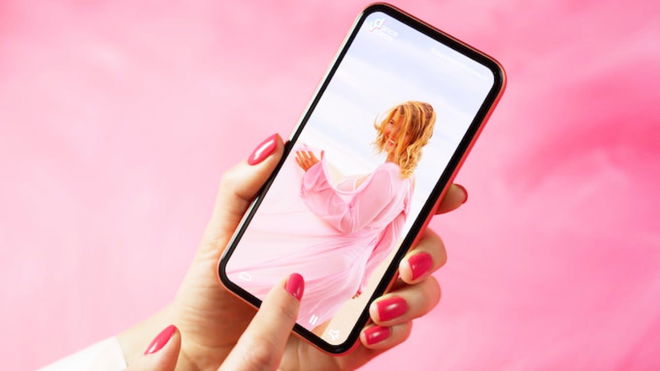 An image of a person watching a TikTok video with the brightness issue