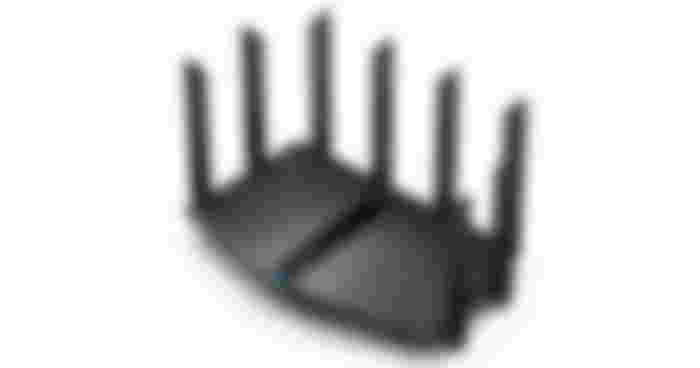 TP-Link Archer AX80 product image of a black Wi-Fi router with a blue light at the front and eight antennae all around it.