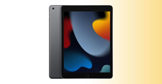 A grey and black iPad with spots of orange, blue, red, and green on the display, with the tablet in front of a white and orange gradient background.