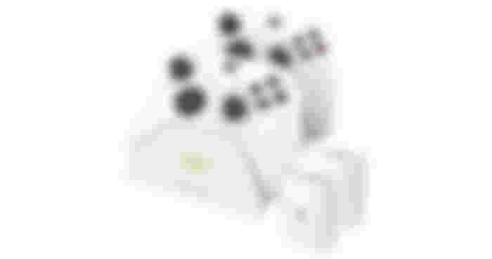 Venom product image of a twin charging dock and two battery packs in white with two white Xbox controllers docked to it.