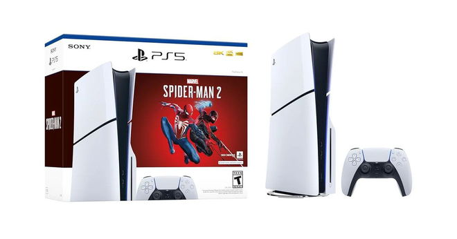 A white and black PS5 Slim next to a PS5 controller and a box featuring Marvel's Spider-Man 2 graphics on the front.