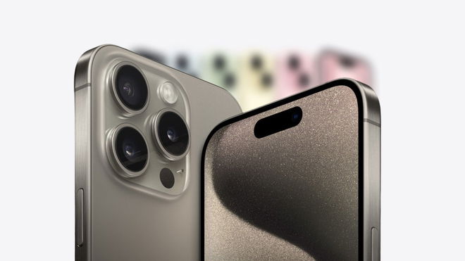 iPhone 15 hero image in front of the iPhone 15 colour line up blurred