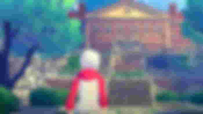 Ashley standing outside of a mansion