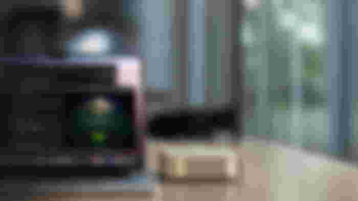 DGX Spark witha laptop next to it.