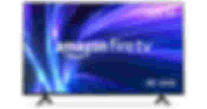 Amazon Fire TV product image of a black TV with a thin frame, plus Amazon Fire branding in white on the display with blue and purple lighting in the background.