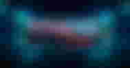 A black SSD featuring gray Samsung branding and red lines across the top in front of a blurry blue backdrop.
