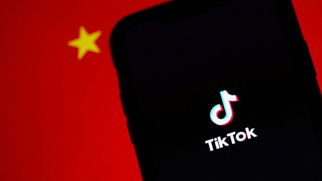 TikTok running on an iPhone. China's flag is displayed behind it.