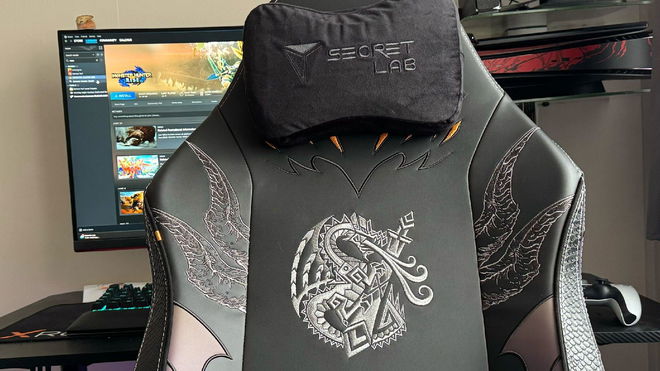 Secretlab Monster Hunter Fatalis TITAN Evo in front of a gaming desk and monitor