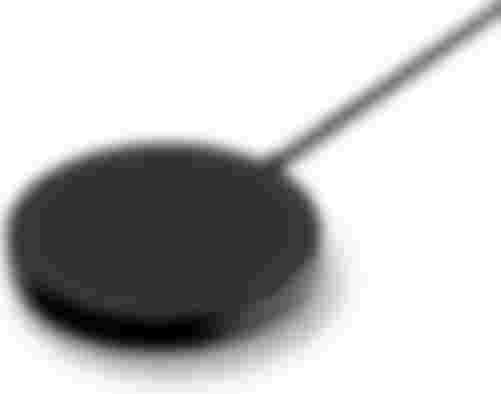 Belkin Boost Charger product image of a black circular wireless charger.