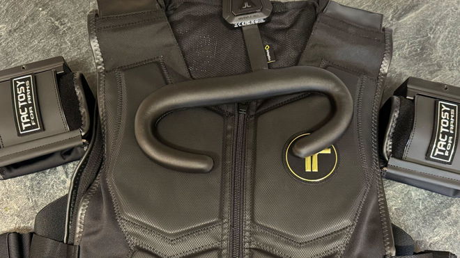 bHaptics TactSuit X40, TactVisor, and Tactosy for Arms laid out on a marble countertop