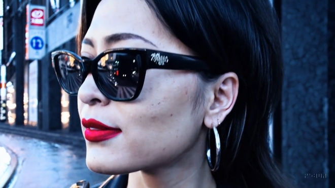 How to access and use Open AI Sora - An image of a woman with a sunglass