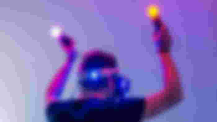 Guy playing Beatsaber on Playstation VR